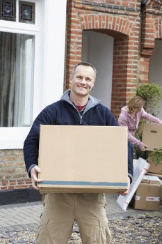 Professional movers handling a home move in Earls Court near local apartment buildings