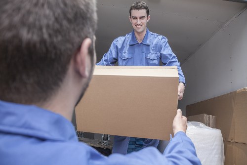 Man and van team loading items safely into a vehicle