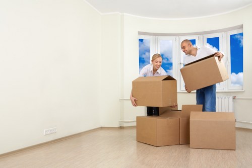 Moving furniture through a narrow stairwell in an Earls Court property