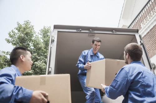 Loading commercial furniture for relocation near Earls Court streets