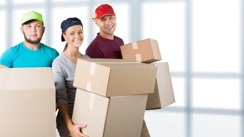 Packed boxes and furniture prepared for a local move in Earls Court