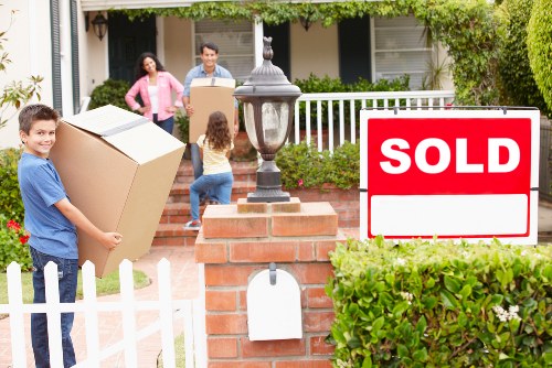 Packed boxes and furniture ready for urgent removals in a West London flat